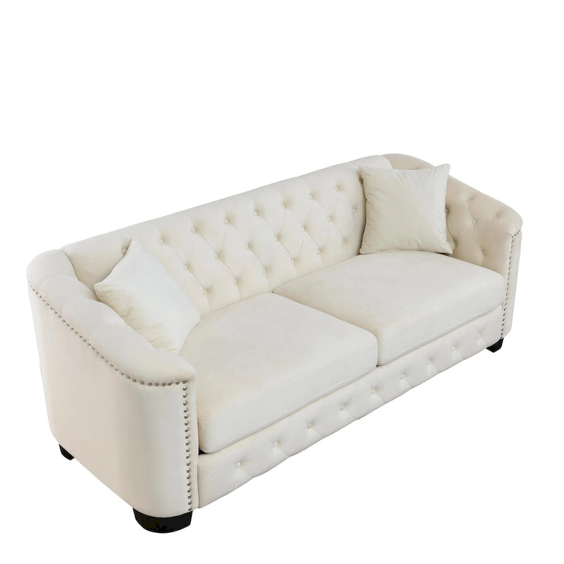 Canapé moderne en velours de 196 cm avec dossier capitonné et accoudoirs ornés de clous décoratifs ; inclut deux coussins décoratifs.
