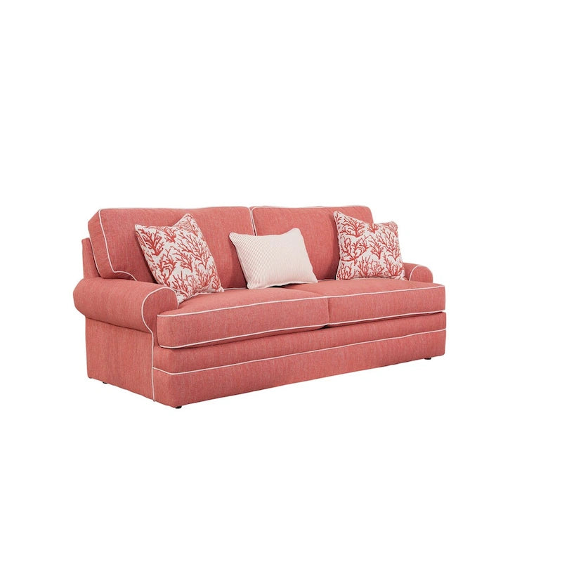 Canapé côtelé de style traditionnel, en tissu mélange polyester-lin couleur corail, doté d'accoudoirs arrondis, de coussins d'assise réversibles et de coussins décoratifs.